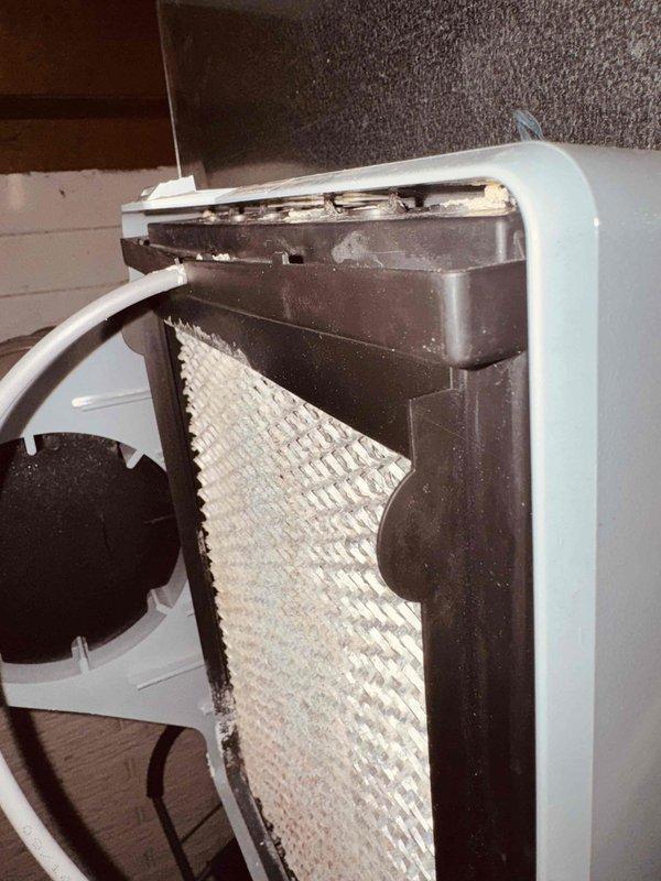 Diagnosed E1 error code on evaporative cooler system and determined humidity sensor failure in humidistat was causing malfunction and inaccurate readings. Replaced defective humidistat with new unit using inventory from service vehicle. System tested and restored to proper operation with humidity sensor now reading correctly and error code resolved.