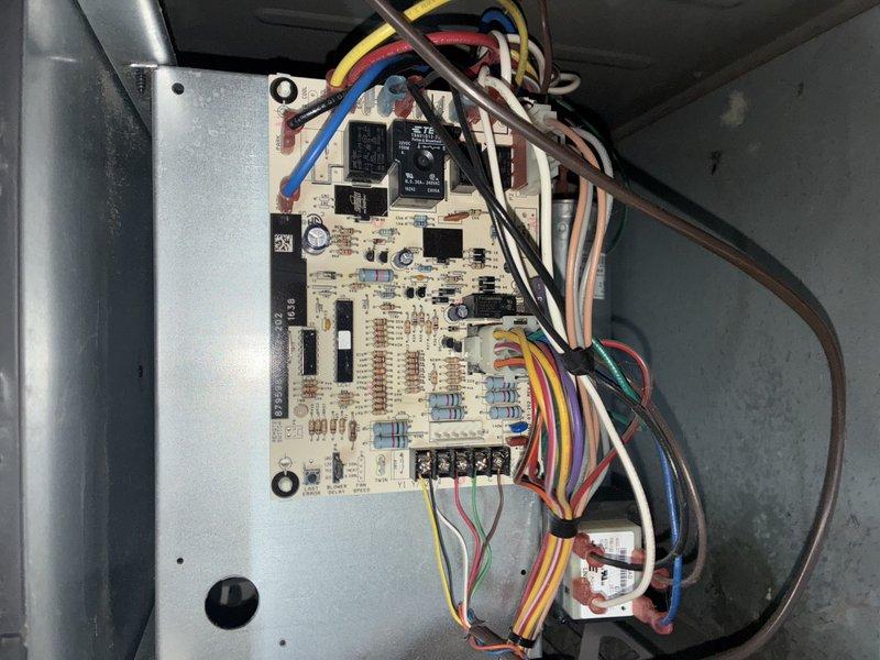 Completed comprehensive cooling maintenance on aging residential air conditioning system. Inspected outdoor condenser unit, which showed significant weathering and dirt accumulation on coil fins and casing, and evaluated internal control board with all electrical connections and components functioning properly. Performed standard preventative maintenance procedures to ensure system operational readiness for continued cooling season performance.