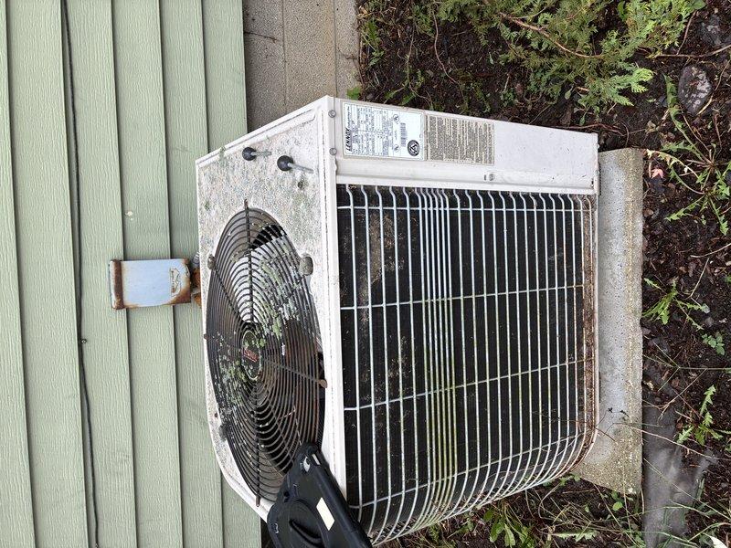 Completed comprehensive cooling maintenance on aging residential air conditioning system. Inspected outdoor condenser unit, which showed significant weathering and dirt accumulation on coil fins and casing, and evaluated internal control board with all electrical connections and components functioning properly. Performed standard preventative maintenance procedures to ensure system operational readiness for continued cooling season performance.