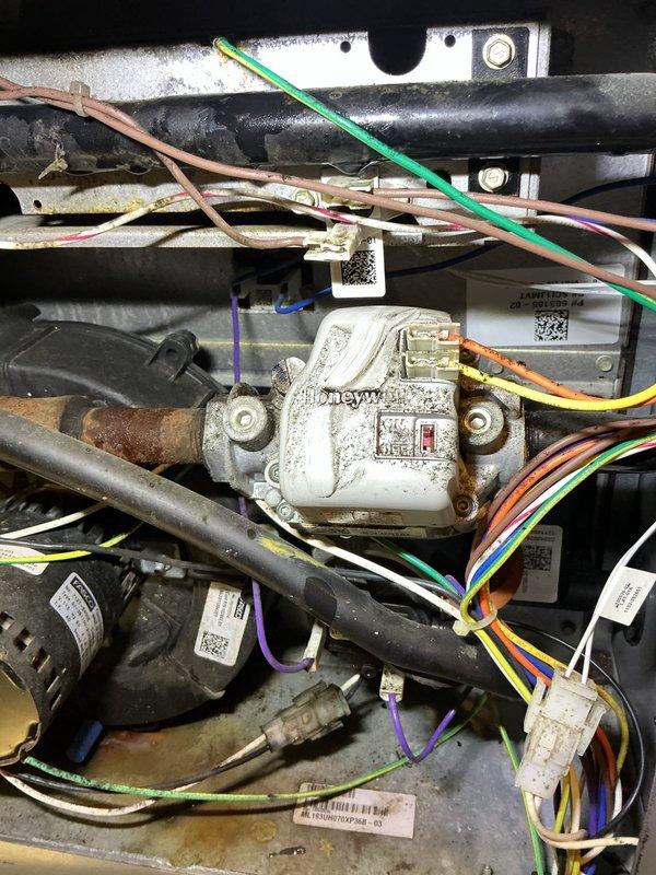 Completed comprehensive heating maintenance and system inspection. Performed thorough examination of internal mechanical components, including compressor assembly, refrigerant lines, and electrical connections. Inspected Honeywell control valve and actuator for proper operation, verified all wiring connections and safety labels were intact. Cleaned accumulated dust and debris from motor assembly and surrounding components. Confirmed all piping, brackets, and mounting hardware were secure and functioning properly.