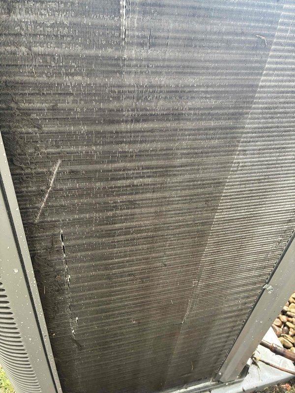 Completed comprehensive MVP air conditioning maintenance on outdoor condensing unit. Performed system diagnostics including electrical measurements, recording operating voltage and amperage readings of 400V and 32.54A respectively using calibrated clamp meter to verify proper compressor and fan motor performance. Inspected exterior coil condition, noting significant accumulation of dirt, dust, and debris within fin spacing and water staining patterns on unit panels indicating need for thorough cleaning during future service intervals. All electrical parameters within manufacturer specifications. System operating properly at time of service completion. Customer approved service renewal for continued maintenance coverage with technician.