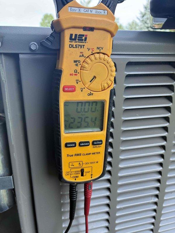 Completed comprehensive MVP air conditioning maintenance on outdoor condensing unit. Performed system diagnostics including electrical measurements, recording operating voltage and amperage readings of 400V and 32.54A respectively using calibrated clamp meter to verify proper compressor and fan motor performance. Inspected exterior coil condition, noting significant accumulation of dirt, dust, and debris within fin spacing and water staining patterns on unit panels indicating need for thorough cleaning during future service intervals. All electrical parameters within manufacturer specifications. System operating properly at time of service completion. Customer approved service renewal for continued maintenance coverage with technician.