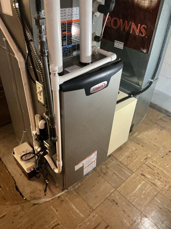 Responded to no-cooling complaint on newly installed Lennox system. Upon arrival, confirmed outdoor condensing unit fan motor was not operating. Diagnosed failed capacitor preventing compressor and condenser fan operation. Replaced defective dual-run capacitor with OEM replacement part, restoring proper system function. Verified correct amperage draw on both compressor and fan motor, confirmed adequate refrigerant charge, and tested system through complete cooling cycle. Unit now operating within manufacturer specifications with proper airflow and temperature differential across evaporator coil.