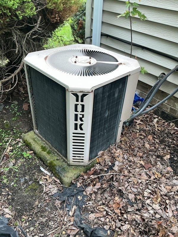 Responded to no cooling call on 10+ year old York AC unit. Upon inspection, diagnosed failed dual run capacitor preventing compressor and condenser fan operation. Replaced defective capacitor with properly rated component, restored system to normal operation, and verified proper amperage draw and cooling cycle.
