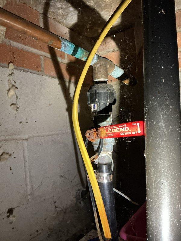 Responded to service call for stuck main water valve to entire house. Upon inspection, determined the existing valve had seized and could not be operated without risk of damage. Replaced the main water shutoff valve with new ball valve assembly, including proper shut-off of water supply, removal of corroded valve, installation of new valve with appropriate fittings, and pressure testing to ensure proper operation. Also inspected and verified proper function of under-sink shutoff valves in bathroom to ensure secondary isolation points were operational.