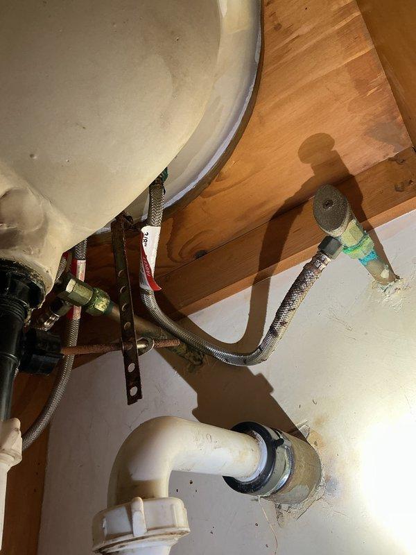 Responded to service call for stuck main water valve to entire house. Upon inspection, determined the existing valve had seized and could not be operated without risk of damage. Replaced the main water shutoff valve with new ball valve assembly, including proper shut-off of water supply, removal of corroded valve, installation of new valve with appropriate fittings, and pressure testing to ensure proper operation. Also inspected and verified proper function of under-sink shutoff valves in bathroom to ensure secondary isolation points were operational.