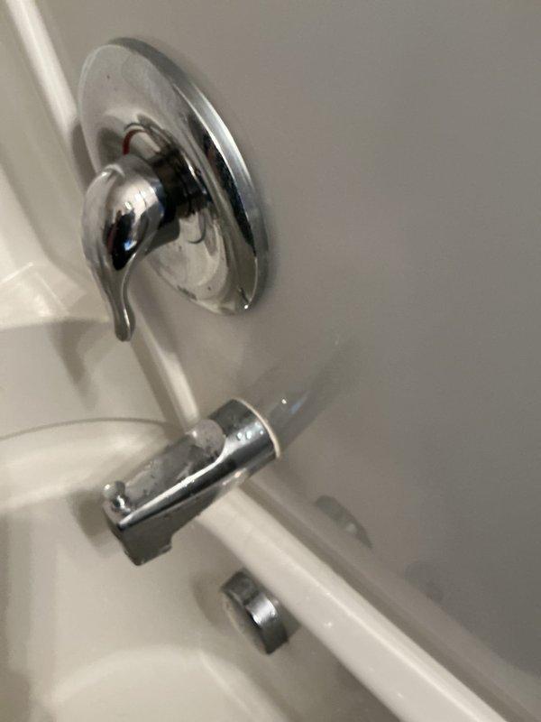Responded to service call for leaky bathtub faucet in residential bathroom. Upon inspection, identified faulty cartridge in single-handle shower control valve as source of leak. Removed existing cartridge using appropriate extraction tools and replaced with new Moen 1222-B cartridge. Tested fixture operation to confirm proper function and verified leak was resolved.