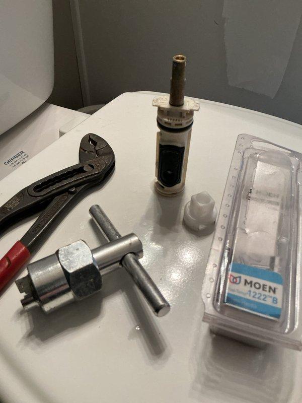 Responded to service call for leaky bathtub faucet in residential bathroom. Upon inspection, identified faulty cartridge in single-handle shower control valve as source of leak. Removed existing cartridge using appropriate extraction tools and replaced with new Moen 1222-B cartridge. Tested fixture operation to confirm proper function and verified leak was resolved.