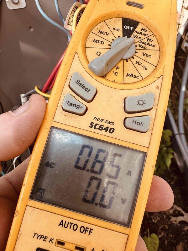 Completed MVP recurring cooling maintenance visit. Inspected electrical control panel wiring and connections, verified proper termination of multi-conductor wiring at terminal block, and confirmed all safety labeling present. Performed electrical diagnostics using digital multimeter, measuring current draw of 0.65 amps and verifying voltage readings to ensure system operating within normal parameters.