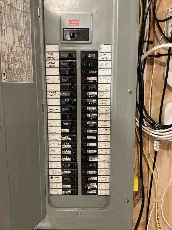 Completed electrical estimate for generator installation at residential property. Documented existing electrical panel configuration, including main breaker and circuit distribution for future generator integration planning. Photographed current electrical infrastructure to assess capacity and determine optimal connection point for standby generator system.