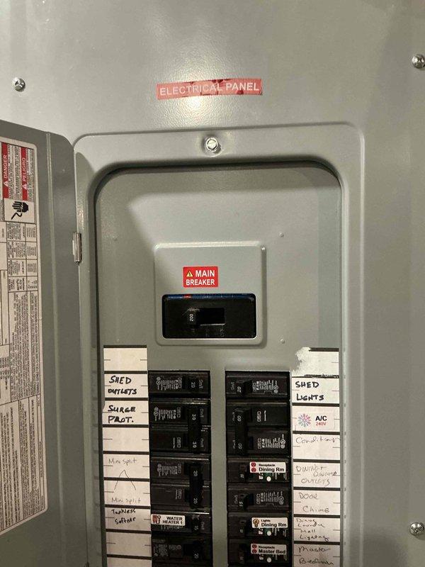 Completed electrical estimate for generator installation at residential property. Documented existing electrical panel configuration, including main breaker and circuit distribution for future generator integration planning. Photographed current electrical infrastructure to assess capacity and determine optimal connection point for standby generator system.