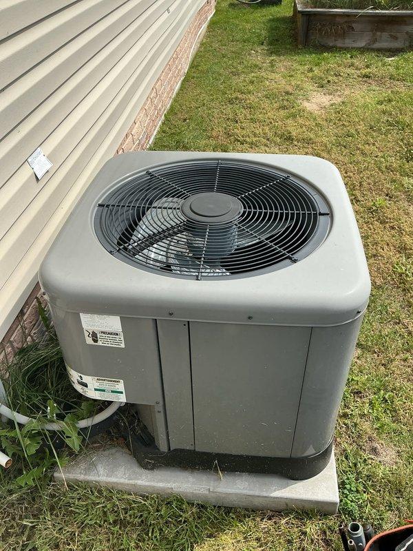 # HVAC Service Report

Responded to no cooling complaint at manufactured home. Upon inspection, found outdoor condensing unit operational but system not producing adequate cooling. Accessed electrical compartment and identified failed dual run capacitor as root cause. Capacitor tested below acceptable microfarad range, preventing compressor from starting properly. Removed defective capacitor and installed new replacement unit with correct specifications. Verified all electrical connections secure and properly terminated. Cleared vegetation growth around unit that had accumulated near base and electrical components. Tested system operation after repair - compressor engaged properly, unit cycling normally, and cold air restored to living space. System returned to full cooling capacity.