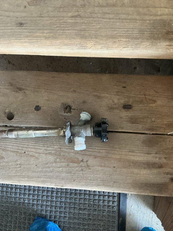 Installed new shutoff valve for ice maker line using compression-by-compression connection, requiring ceiling access in basement for proper installation. Removed existing outdoor sillcock and replaced with frost-free sillcock equipped with shutoff valve to prevent freeze damage. Installed access panel at spigot location for future maintenance accessibility.