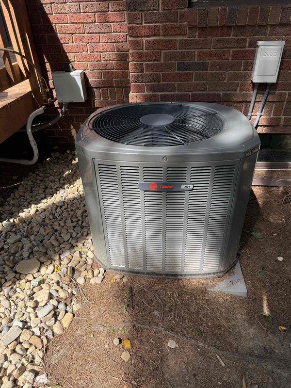 Completed comprehensive MVP AC maintenance on Trane XV series air conditioning system. Performed visual inspection of outdoor condenser unit, verifying proper operation of compressor and condenser fan, checking refrigerant lines for leaks or damage, and cleaning debris from unit exterior and grille. Inspected indoor furnace and evaporator coil assembly in basement mechanical room, examined condensate drain system with PVC piping configuration for proper drainage and clearing any blockages, verified airflow through ductwork, and checked electrical connections at both indoor and outdoor units. System tested and operating within normal parameters upon completion of maintenance service.