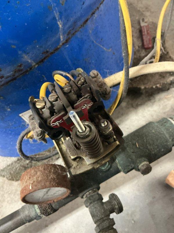 Responded to no water/zero pressure complaint at residential property on well system. Upon arrival, inspected well pump system and electrical components in mechanical room. Found faulty pressure switch and relay assembly preventing pump operation. Tested electrical connections at junction box and verified power supply to pump motor. Replaced defective pressure switch and cleaned corroded terminals on relay contactor. Inspected green circulation pump for proper operation and verified all gate valves were in open position. Checked pressure gauge readings and confirmed system was building adequate pressure. Cycled pump multiple times to ensure proper cut-in/cut-out function of new pressure switch. Restored full water pressure throughout residence and verified flow at multiple fixtures. System operating normally at time of departure.
