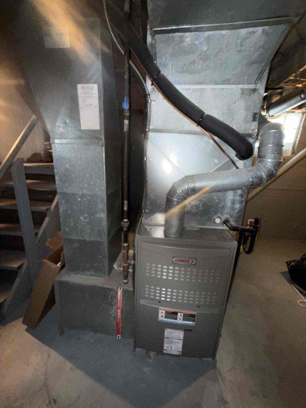 Completed MVP cooling maintenance visit on residential Lennox HVAC system. Inspected and photographed electrical components, including 30-amp time-delay fuses showing signs of oxidation on copper end caps, which were documented for monitoring. Verified proper operation of furnace unit, ductwork connections, refrigerant lines, and condensate drainage system with all components functioning within normal parameters.