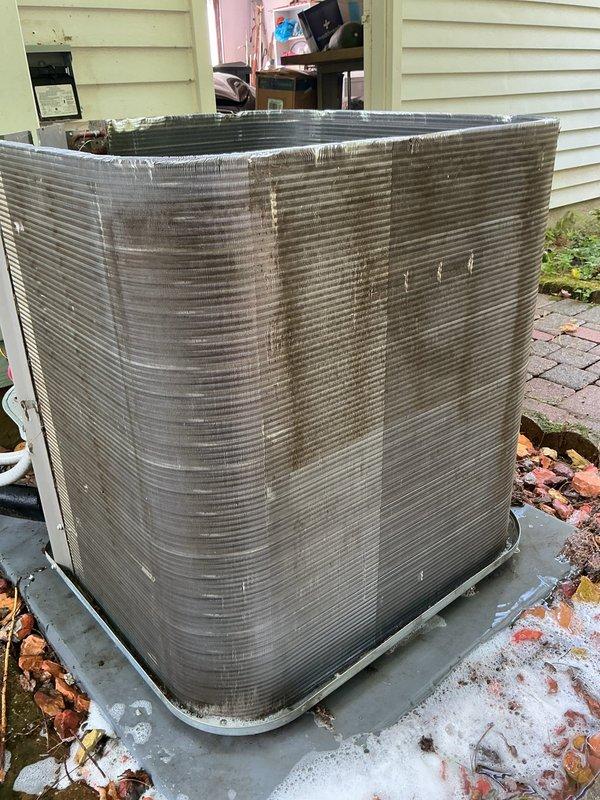 Completed MVP air conditioning maintenance on outdoor condenser unit. Performed comprehensive system inspection, cleaned accumulated debris and leaves from unit exterior and surrounding area, checked refrigerant levels and electrical connections, and verified proper operation of all components. Unit showed signs of age with surface weathering but demonstrated satisfactory performance upon testing.