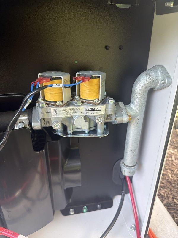 Responded to E1100 fault code indicating an overcrank condition on residential Generac backup generator. Inspected gas valve assembly and fuel delivery system, verified proper operation of electromagnetic coils and connections. Cycled generator under no-load conditions to confirm system returned to normal operation after fault reset.
