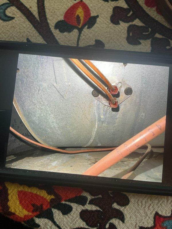 Responded to no cooling complaint on 7-year-old AC system that remained non-functional following previous service visit. Performed comprehensive system evaluation using inspection camera to assess internal components and ductwork connections. Documented refrigerant line routing and plenum configuration, identifying potential issues with system operation that required further diagnostic attention beyond initial assessment.