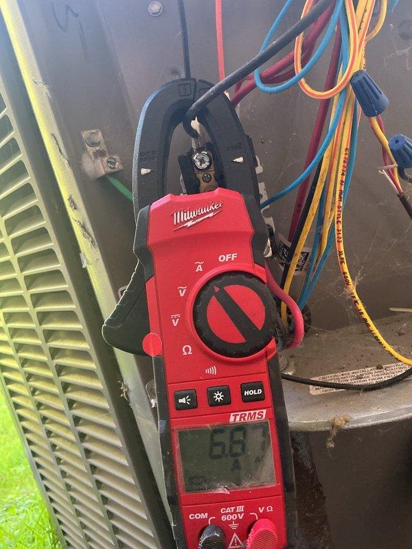 Completed MVP air conditioning maintenance service. Inspected and tested electrical components including time-delay fuses rated at 250V in outdoor disconnect, verified proper amperage ratings and fuse integrity. Performed electrical diagnostics using clamp meter to measure current draw on system wiring, confirmed normal operating parameters within manufacturer specifications. All electrical connections, wiring, and safety components found in satisfactory working condition.