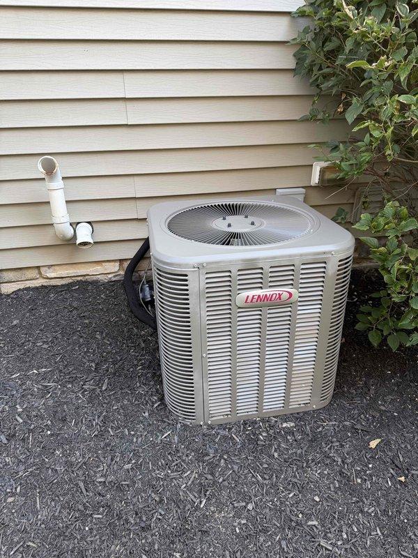 Completed MVP air conditioning maintenance on a 10-year-old Lennox cooling system. Performed comprehensive inspection of outdoor condensing unit, confirmed proper operation of all components, and documented equipment condition including notable rust and corrosion present at the evaporator coil drain pan junction requiring future monitoring.