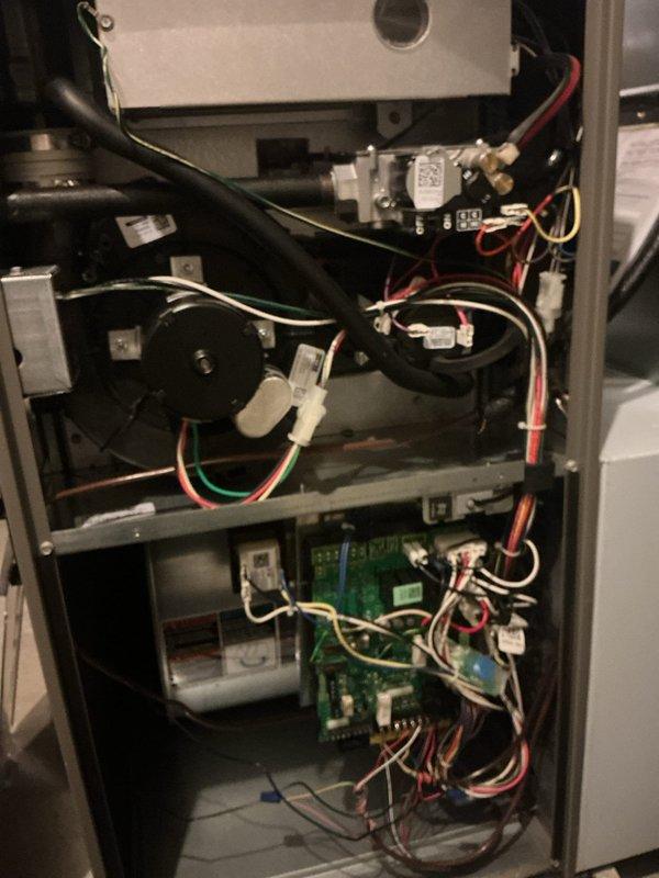 Completed MVP annual cooling maintenance on 8-year-old residential air conditioning system. Performed comprehensive inspection of indoor air handler components including blower motor assembly, electrical connections, and control board. Verified proper operation of all electrical components and connections. Inspected outdoor condensing unit positioned on concrete pad with rock bed surround. Confirmed unit is level and properly supported on pavers. Checked refrigerant levels, tested system operation, and verified airflow. All components functioning within normal parameters. System operating efficiently with no issues identified.