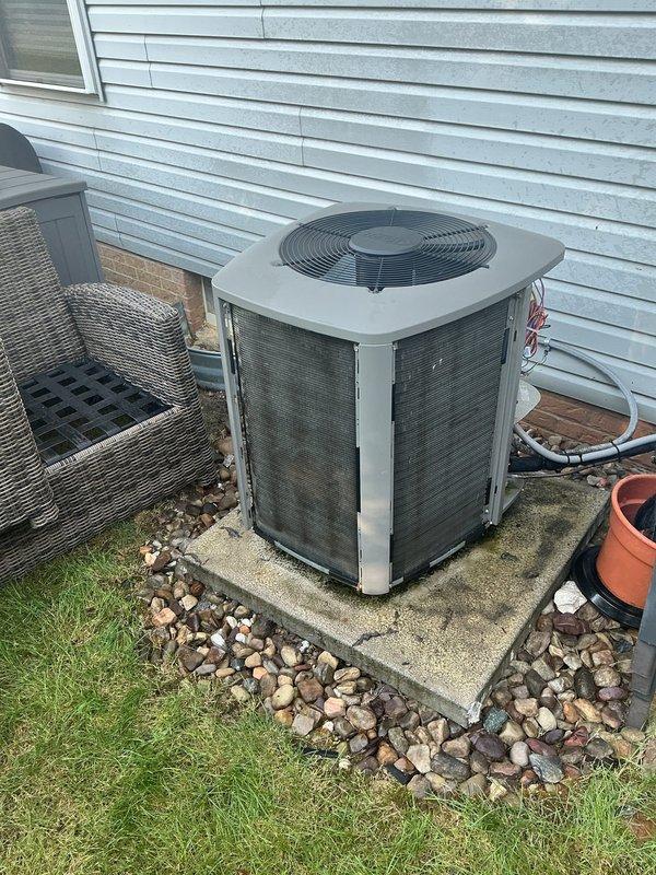 Completed MVP annual cooling maintenance on 8-year-old residential air conditioning system. Performed comprehensive inspection of indoor air handler components including blower motor assembly, electrical connections, and control board. Verified proper operation of all electrical components and connections. Inspected outdoor condensing unit positioned on concrete pad with rock bed surround. Confirmed unit is level and properly supported on pavers. Checked refrigerant levels, tested system operation, and verified airflow. All components functioning within normal parameters. System operating efficiently with no issues identified.