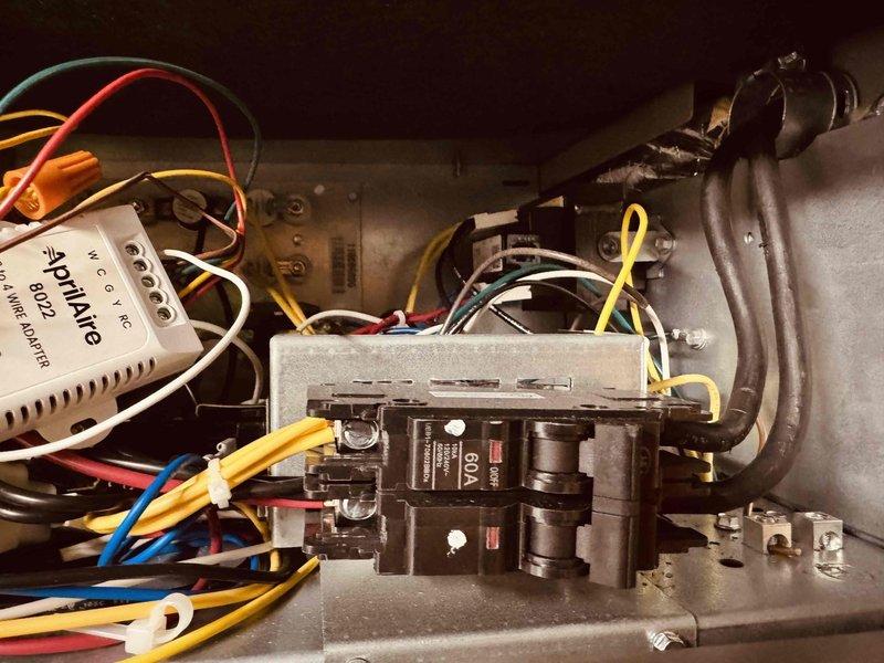 Completed annual heating maintenance and tune-up on 11-year-old Trane HVAC system per scheduled service one year post-installation. System was operational upon arrival and confirmed working properly throughout inspection. Performed comprehensive heating system evaluation including inspection of electrical control panel, circuit breakers (dual 50A breakers verified), Aprilaire control module (model 8022), control board functionality, and all associated wiring connections. Verified proper wire terminations, checked all wire nut connections for security, and inspected blower motor compartment and electrical components for wear or damage. All control circuits, power distribution components, and safety devices tested and found operating within manufacturer specifications. System left in full operational condition with heating functionality confirmed.
