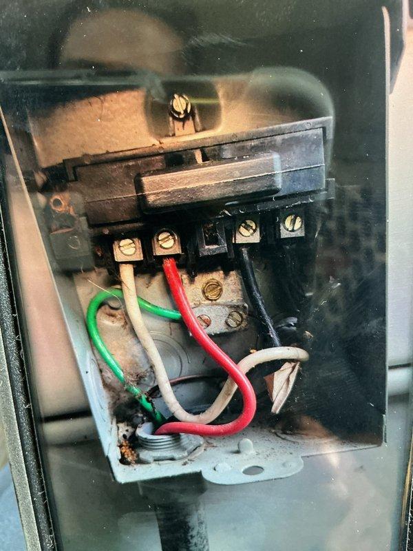Completed preventative maintenance cooling visit on two residential air conditioning systems. Performed comprehensive inspection of both units, including the original system that came with the property and a newer replacement system. Inspected electrical disconnect boxes, noting aged wiring connections with some corrosion present on terminal blocks and mounting plates. Examined contactor assemblies and electrical components for proper operation. All connections were verified secure, and both systems were found operating within normal parameters for continued seasonal use.
