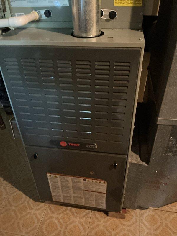 Completed comprehensive tune-up on 8-year-old Trane split system including indoor furnace and outdoor condensing unit. Performed standard maintenance procedures including filter inspection, electrical connections check, refrigerant level verification, condensate drain evaluation, and overall system operational testing. All components found operating within normal parameters with no immediate repairs required at time of service.