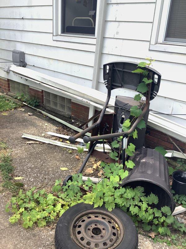 Responded to storm damage assessment for residential air conditioning condenser unit impacted by fallen gutters. Conducted on-site inspection and documented exterior damage to outdoor condensing unit with photographic evidence. The older model AC unit showed weathering and potential structural compromise from gutter impact, requiring full system evaluation to determine repair versus replacement recommendation for homeowner.