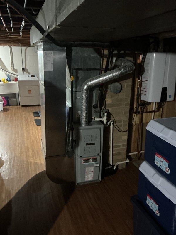 Completed installation of a new high-efficiency furnace system rated at 90% AFUE in the basement mechanical room. The unit was properly positioned, insulated, and connected to existing ductwork with new flexible supply connections routed to the overhead distribution system. All combustion air piping, venting through the existing chimney chase, electrical connections, and condensate pump integration were completed per manufacturer specifications and local code requirements. System was tested, fired successfully, and verified to be operating within normal parameters.