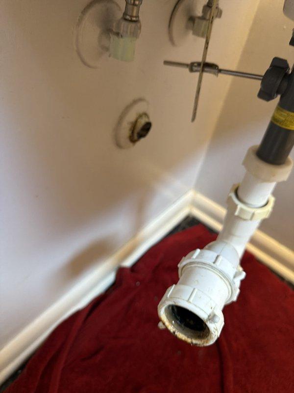 Responded to a service call for corroded plumbing beneath a bathroom sink. Upon inspection, identified severe corrosion on the pipe connecting the P-trap assembly to the wall drain, which posed risk of leakage and water damage. Removed the deteriorated section and replaced with new PVC piping, ensuring proper alignment and secure connections. Tested the drain system for leaks and verified proper water flow. All plumbing components are now functioning correctly with no signs of leakage.