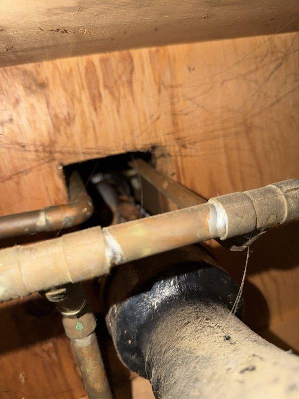 Responded to a service call for corroded plumbing beneath a bathroom sink. Upon inspection, identified severe corrosion on the pipe connecting the P-trap assembly to the wall drain, which posed risk of leakage and water damage. Removed the deteriorated section and replaced with new PVC piping, ensuring proper alignment and secure connections. Tested the drain system for leaks and verified proper water flow. All plumbing components are now functioning correctly with no signs of leakage.