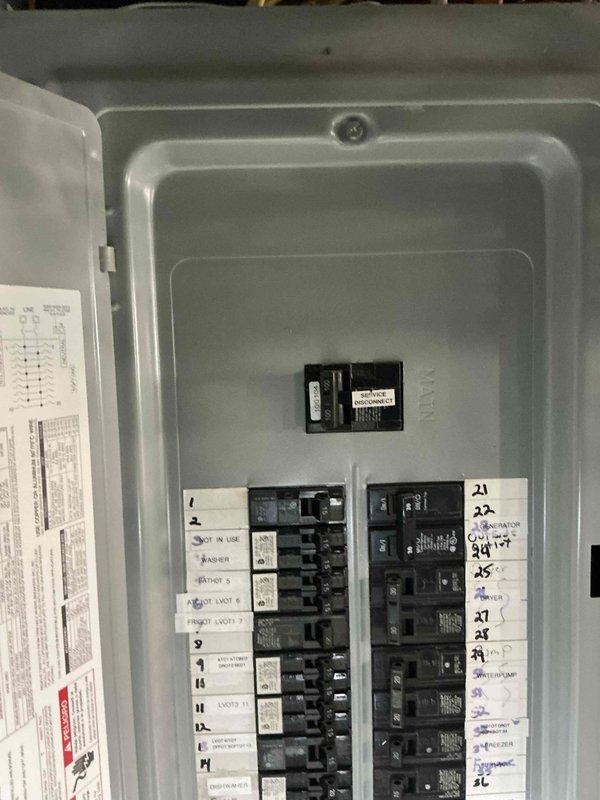 Conducted on-site evaluation for mini split installation on third floor location. Assessed existing electrical panel capacity and circuit availability to determine feasibility for new mini split system power requirements. Documented electrical panel configuration showing adequate breaker positions and load capacity for proposed 9,000 BTU mini split unit installation.