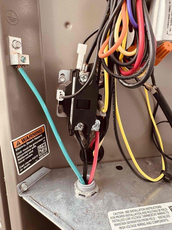 Performed courtesy start-up inspection on 7-month-old air conditioning system. Verified electrical connections within control panel, documented system specifications including R454B refrigerant charging information, normal operating pressures, approach values, and subcooling parameters per manufacturer specifications. All components found operating within normal parameters and unit functioning properly.
