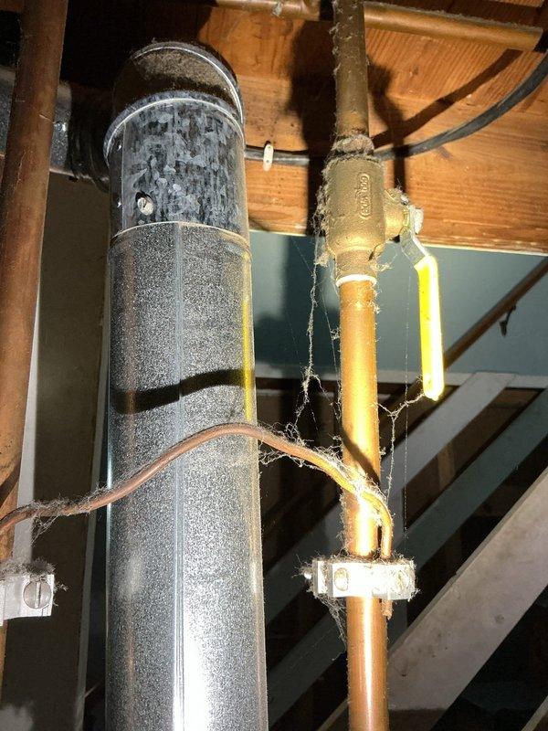 Performed on-site assessment of existing water heater system to provide estimate for replacement unit. Customer requested specifications for 40-gallon capacity, 40,000 BTU tanked water heater installation. Inspected current US/Craftmaster water heater unit, documenting manufacturer specifications including 150 PSI working pressure rating and flammable vapor-resistant design. Evaluated existing plumbing connections including copper supply lines, brass shutoff valve, and vent ductwork configuration. Photographed installation area and equipment specifications to prepare accurate replacement estimate with appropriate sizing and venting requirements.