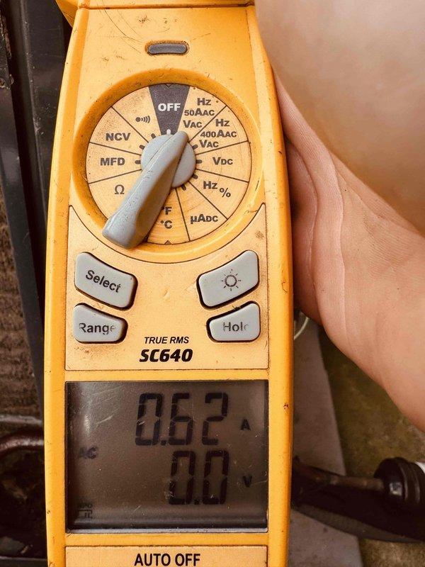 Responded to no-cooling call on 10-year-old Trane outdoor unit. Upon arrival, confirmed thermostat was functioning properly but AC system would not start. Performed diagnostic testing using digital multimeter to check electrical components and measured amperage draw at 5.06 amps and capacitance reading of 0.62 microfarads. Identified failed run capacitor as root cause preventing compressor from starting. Replaced defective capacitor with manufacturer-specified component, restored power to unit, and verified proper system operation with normal amperage readings and cooling cycle initiation.