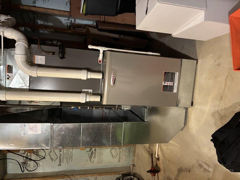 Completed MVP recurring cooling maintenance visit on residential HVAC system over 14 years old. Performed standard inspection of furnace/air handler unit, confirmed proper operation of all components, and documented equipment condition with photos showing existing foam sealant at panel seams and supply lines. All systems operating within normal parameters.