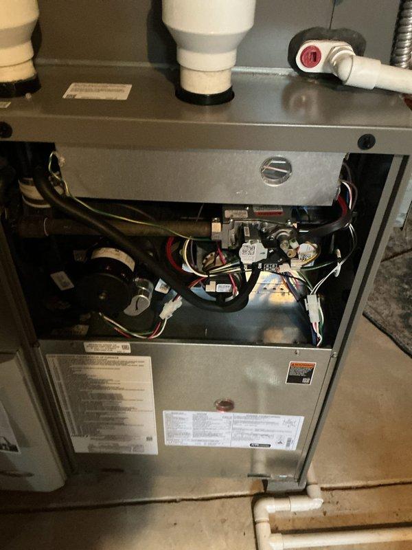 Completed routine MVP cooling maintenance visit on residential HVAC system. Performed comprehensive inspection of furnace unit interior components, including electrical connections, control board, ignition module, and pressure switch assembly. Verified proper operation of all system components, checked refrigerant lines and gas connections, and confirmed venting system integrity. All equipment found operating within normal parameters with standard dust accumulation noted.