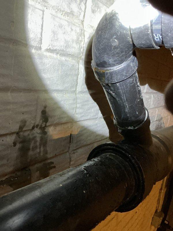 Responded to a plumbing emergency involving a cracked ABS drainpipe connecting the condensate pump pit to the main sewer line leading to the septic tank. Located and assessed multiple cracks in the 2.5-inch O.D. pipe in the basement near the sewer pipe exit point, which was actively leaking during pump operation. Replaced the damaged ABS pipe section with new piping, installed proper fittings and clamps at connection points, and tested the system to ensure watertight integrity during pump cycles.