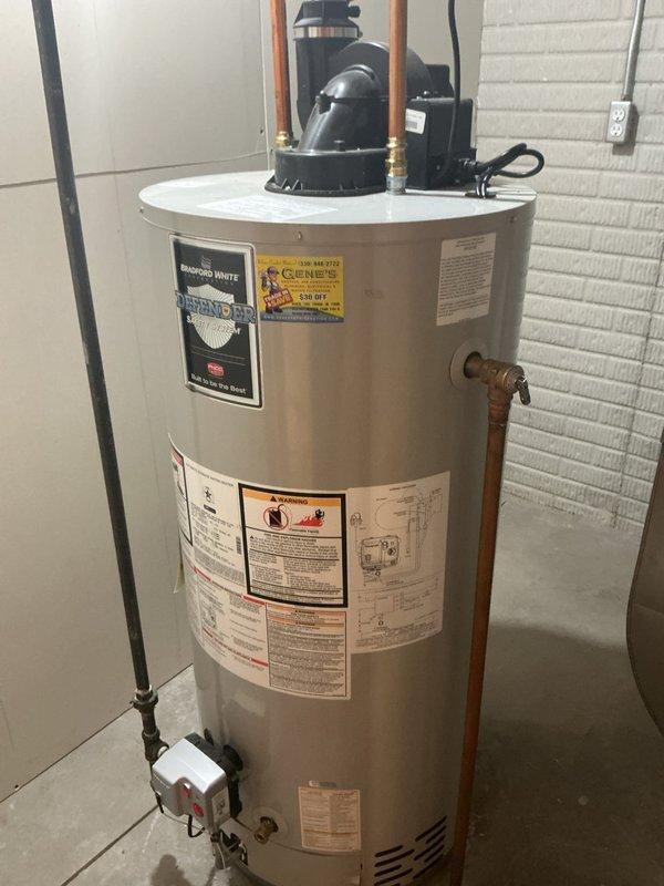 Responded to service call for residential tanked water heater displaying error code and failing to heat water. Upon arrival, performed diagnostic assessment of the unit and associated components. Inspected electrical connections, control box, and thermostat assembly mounted on the tank exterior. Verified proper power supply to the unit and tested heating element functionality. Cleared error code from the control system and reset the temperature controls to manufacturer specifications. Checked all copper piping connections, pressure relief valve, and circulation pump assembly for proper operation. Confirmed the heating elements were cycling correctly and water temperature was rising to setpoint. Verified all safety labels and warning indicators were visible and intact on the unit. System returned to full operational status with proper heating performance restored.