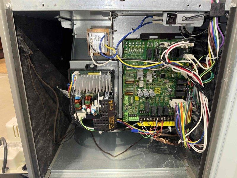 Completed annual maintenance on 11-year-old residential air conditioning system. Performed comprehensive inspection of Lennox HVAC equipment including furnace and air handler units located in basement mechanical room. Accessed and inspected control board assembly, verifying proper operation of electronic components, circuit boards, and electrical connections. Examined wiring harness integrity, terminal connections, and safety controls within equipment cabinet. Checked all manufacturer labels and specifications for compliance. Inspected condensate drainage system including PVC piping and verified proper routing and flow. System operational and ready for cooling season.
