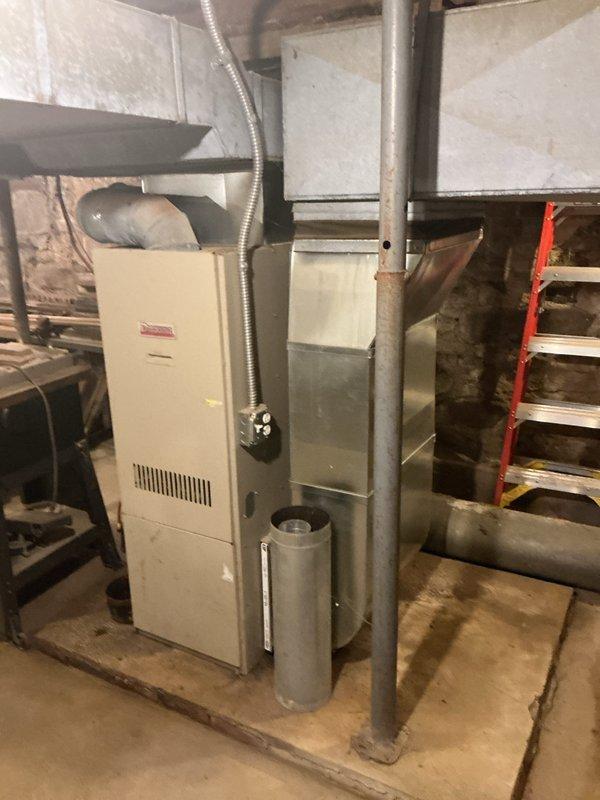 Completed full HVAC system installation including new air handler, heat pump, and humidifier in basement utility area. Reconnected supply trunk ductwork under stairs, installed all necessary metal ductwork transitions and flexible duct connections, and established proper ventilation pathways. All equipment positioned on concrete floor with secure connections to existing infrastructure, system tested and operational upon completion.
