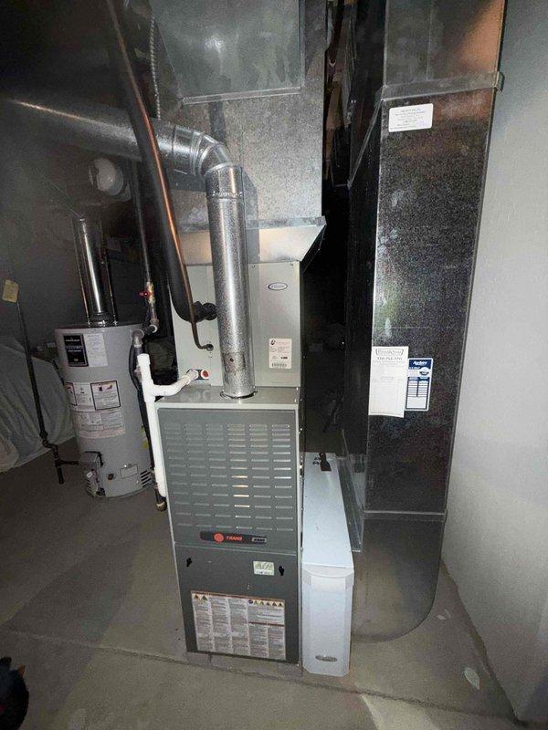 Completed comprehensive MVP heating maintenance on Trane furnace system. Performed thorough inspection of all mechanical components, including blower assembly, heat exchanger, gas valve, and burner operation. Verified proper function of R410A refrigerant system with TXV metering device, inspected copper line sets and connections for integrity, and confirmed all electrical connections were secure. Checked condensate drainage system including PVC drain lines, tested safety controls and limit switches, and examined ductwork connections for proper sealing. All equipment found operating within manufacturer specifications with no deficiencies noted.