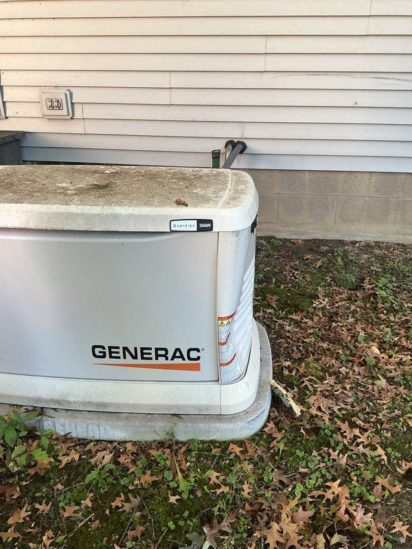 Completed scheduled maintenance on a 2-year-old Generac residential backup generator unit. Performed routine inspection, checked oil levels, examined electrical connections, and verified proper operation of all system components. Unit showed normal weathering for age with minor surface rust and discoloration on exterior housing but all mechanical and electrical systems functioning within manufacturer specifications.