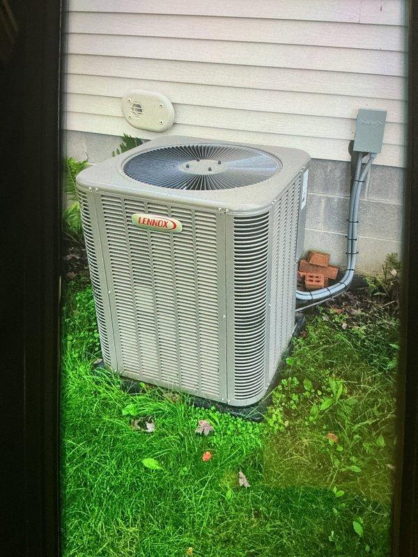 Completed scheduled MVP cooling maintenance visit on Lennox air conditioning system. Performed comprehensive inspection of outdoor condenser unit and indoor evaporator coil assembly, verifying proper operation of all components. Documented system condition through photographic records showing clean evaporator coil fins and properly maintained exterior condenser unit with clear airflow pathways and secure electrical connections at disconnect box.