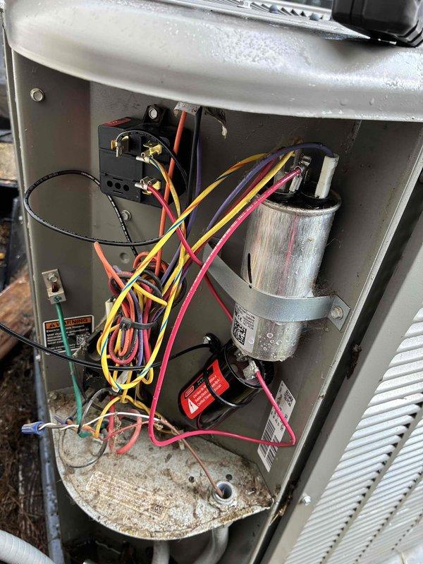 Performed comprehensive AC tune-up on five-year-old garage unit with no reported issues. Inspected and documented electrical components including capacitor, contactor, and transformer connections; verified all wire terminations secure with proper color coding intact. Cleaned accumulated dust and debris from base pan and electrical compartment, confirmed all safety labels present, and verified system operational status with all components functioning within normal parameters.