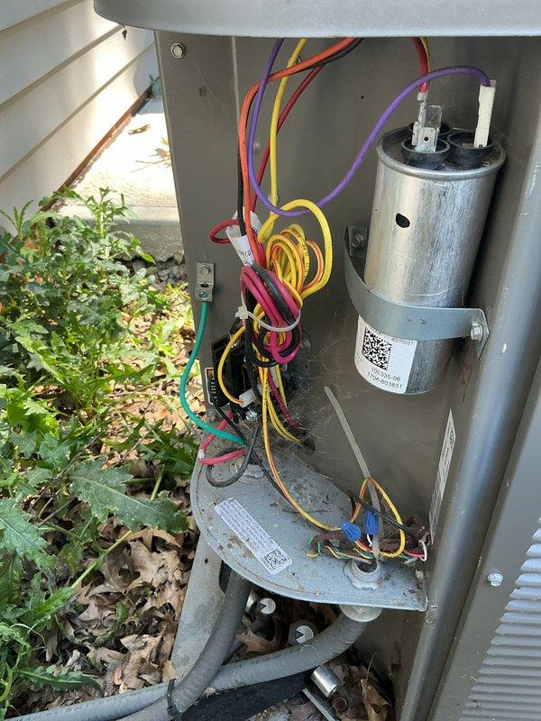 Performed routine maintenance inspection on residential air conditioning system. Accessed electrical compartment to inspect capacitor, wiring connections, and internal components. Verified proper operation of condensing unit, checked for debris accumulation around outdoor unit, and confirmed adequate airflow through condenser coils. System operating within normal parameters upon completion of maintenance visit.
