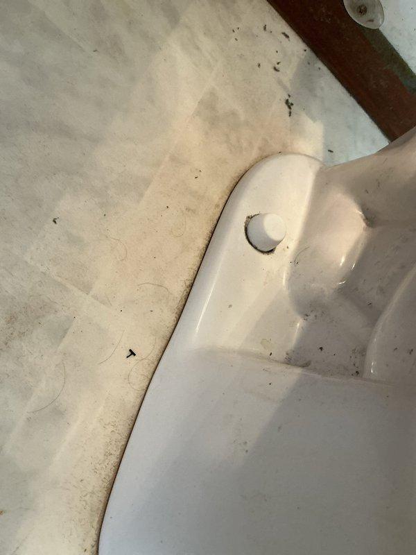 Responded to service call for leaky toilet in single bathroom. Upon arrival, inspected toilet fixture and identified worn flapper valve allowing water to seep from tank into bowl, causing intermittent running and water waste. Replaced defective flapper with new universal rubber flapper assembly, adjusted chain length for proper seal, and tested flush mechanism multiple times to ensure complete seal and proper water shutoff. Verified no leaks at tank bolts, supply line connection, or wax ring seal at base. Documented pre-service and post-repair conditions with photographs. System operating normally upon completion with no active leaks detected.